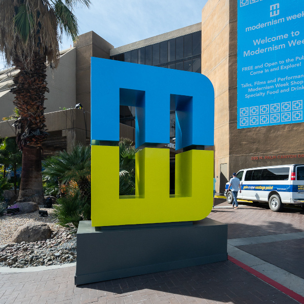 Modernism Week MW logo in front of the Hyatt Palm Springs